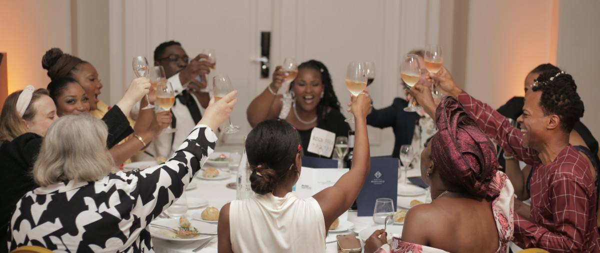 Guests raise their glasses at the festival's gala dinner, in a salon of the Hôtel Martinez (festival photograph): the 2026 gala takes place on Saturday 24 October at the Martinez, and its proceeds help fund the festival, according to the organisers.